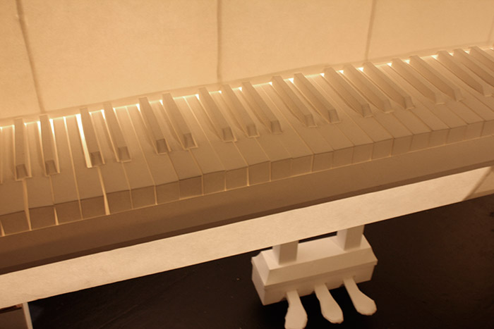 Mirrored copy of real piano used as stage design for the theatre concert Winterreise with music by Schubert. <br>
Drop paper and glue. 1,5 x 1,6 x 1,7 m
